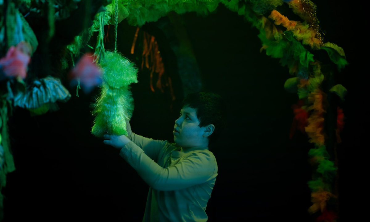 A child is investigating the set