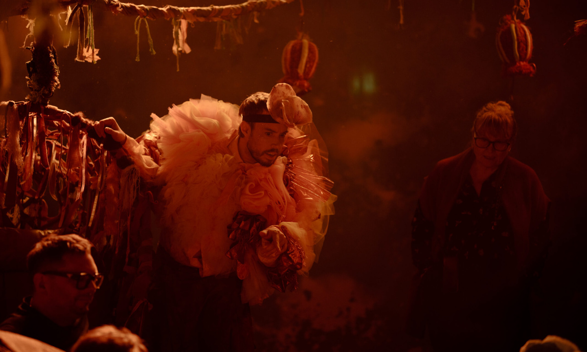 An imaginary world with an actor in the middle in a fluffy costume